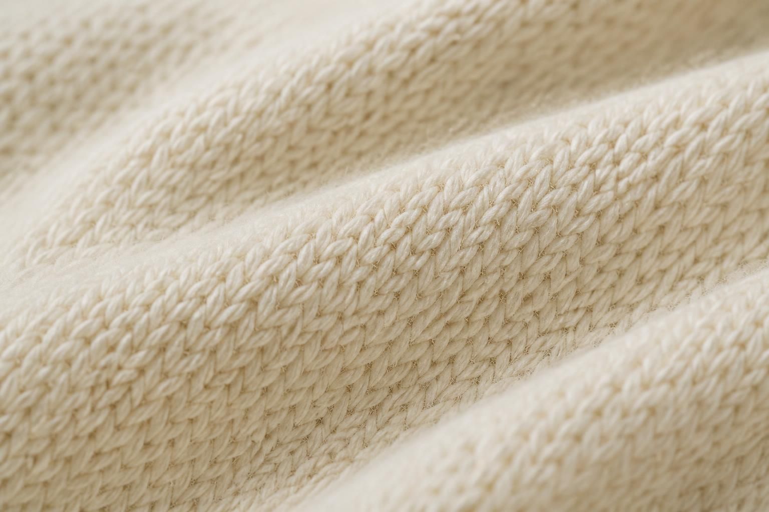 Extreme macro photograph of combed cotton jersey knit showing individual yarn fibers